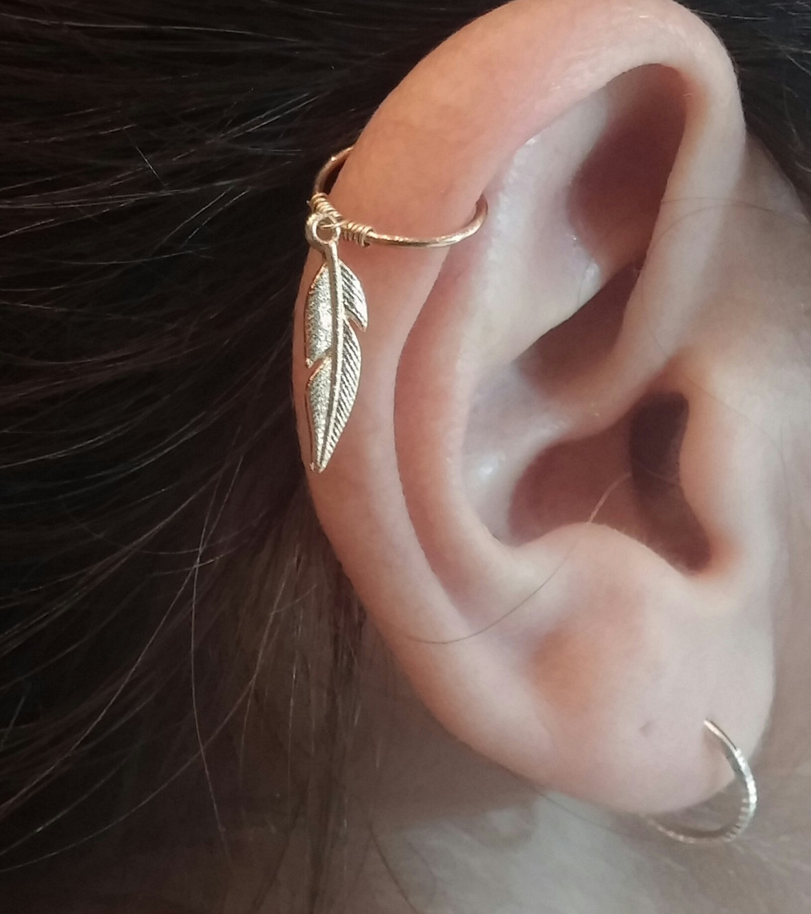 Right Ear Lobe And Forward Pinna Piercing With Feather Ring