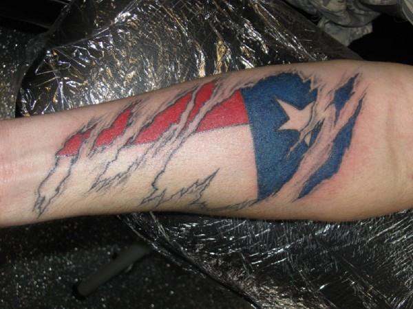 Ripped Skin Texas Flag Tattoo On Forearm