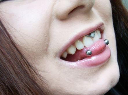 Septum And Horizontal Tongue Piercing