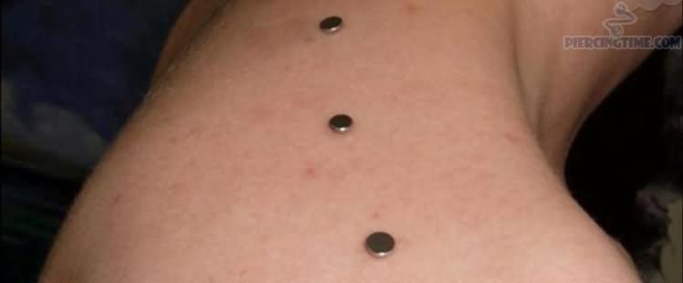 Shoulder Piercing With Silver Dermals