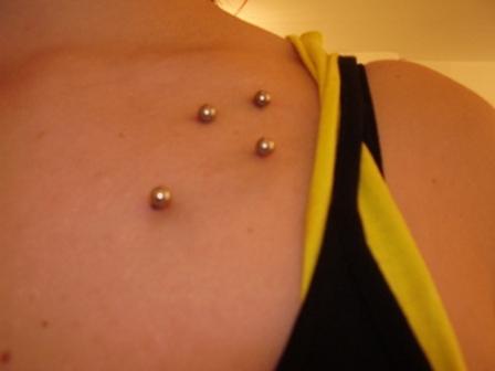 Shoulder Piercing With Silver Studs