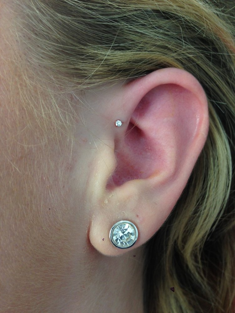 Simple Lobe And Forward Pinna Piercing With Silver Stud