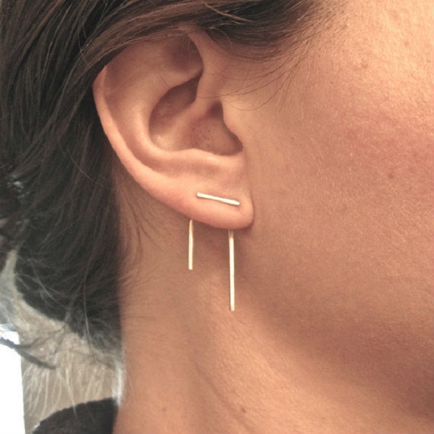 Staple Piercing On Girl Right Ear Lobe