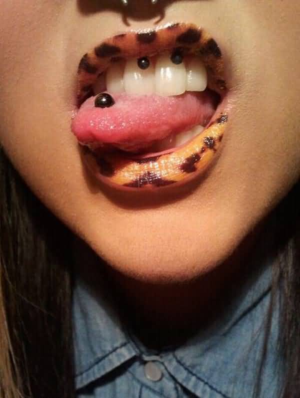 Trendy Girl With Tongue And Gum Piercing With Black Circular Barbell