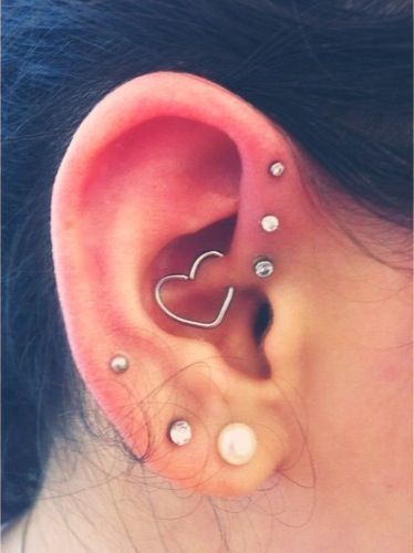 Triple Forward Pinna Piercing And Double Lobe Piercing