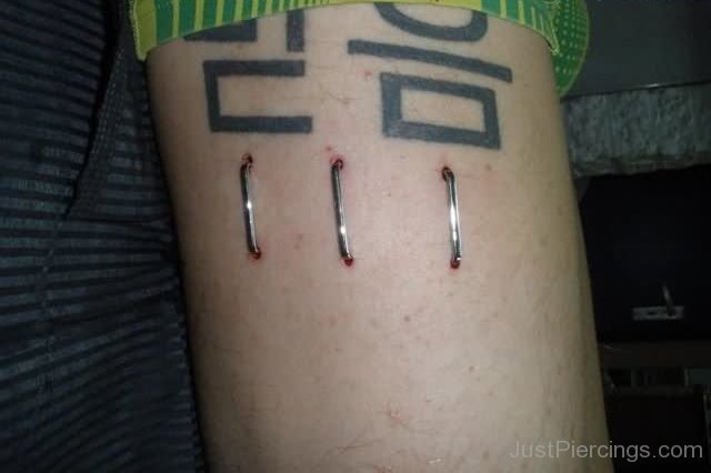 Triple Staple Piercing On Bicep