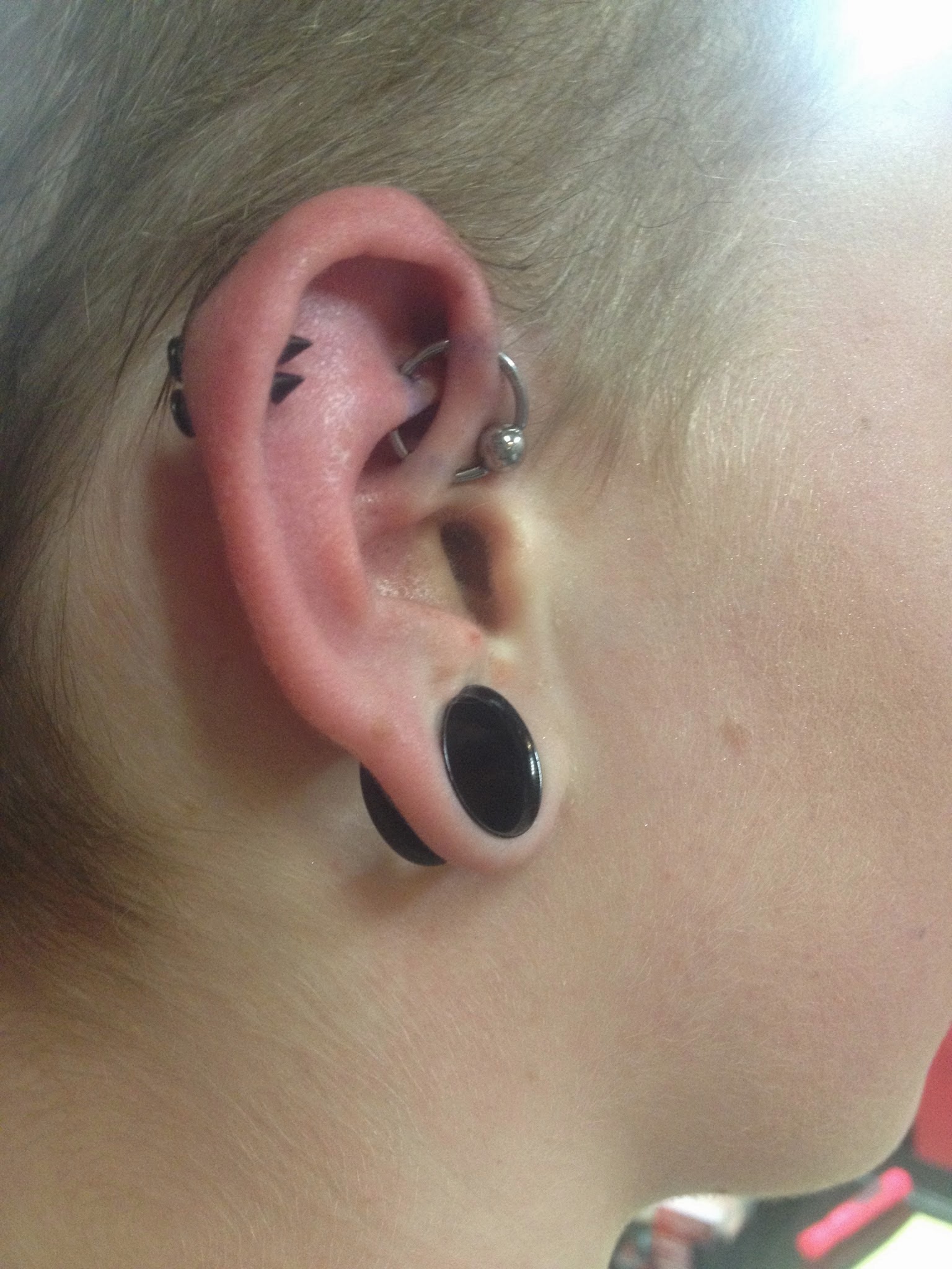 Black Gauge Lobe And UFO Piercing With Silver Bead Ring