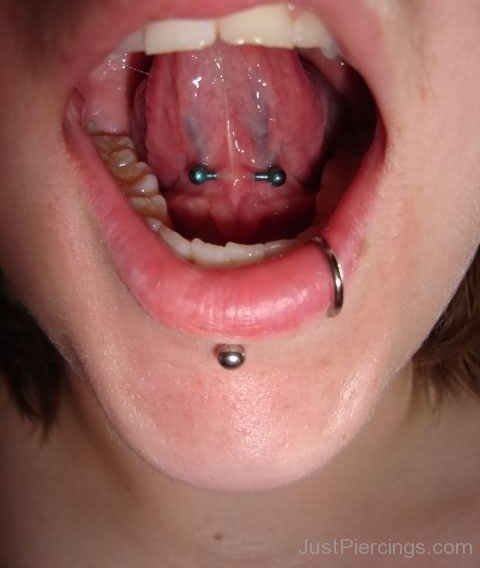 Girl With Lower Lip And Tongue Web Mouth Piercing