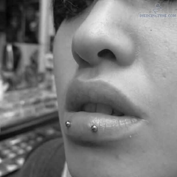 Horizontal Lip Piercing With Silver Studs