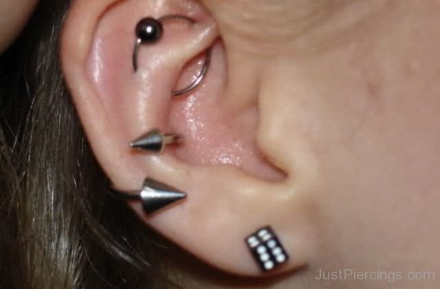 Right Ear Lobe Piercing With Dice Stud And UFO Piercing With Bead Ring