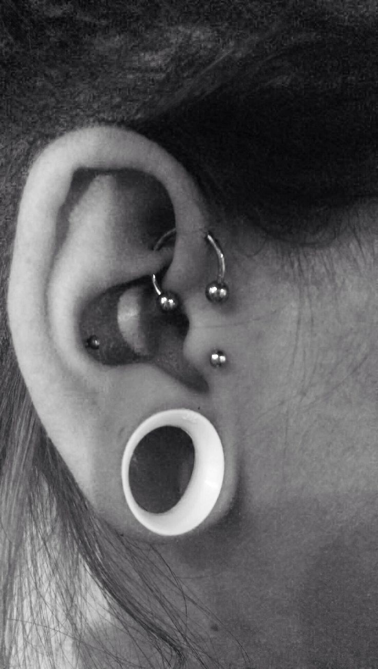 Right Ear Stretched Lobe And UFO Piercing With Circular Barbell