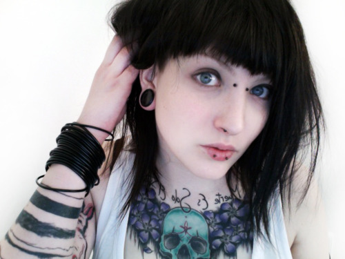 Right Ear Stretching And Horizontal Lip Piercing With Black Barbell