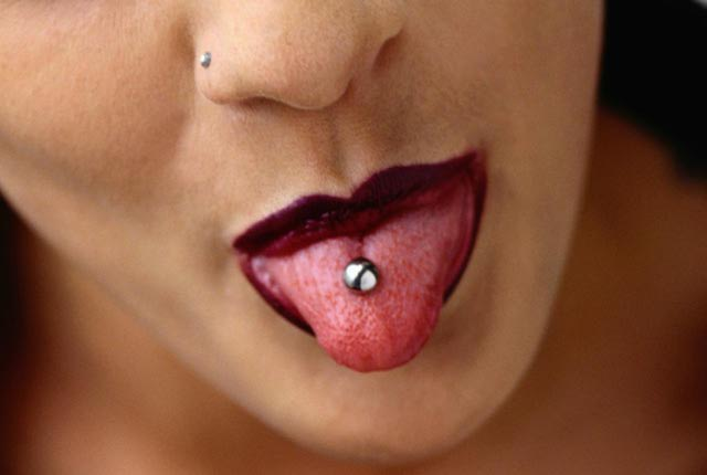 Right Nostril And Tongue Mouth Piercing