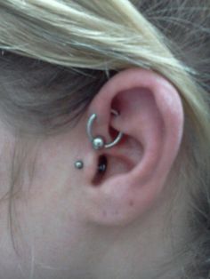 Tragus And UFO Piercing On Left Ear