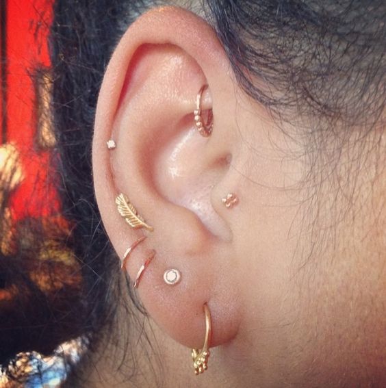 UFO Piercing With Gold Ring