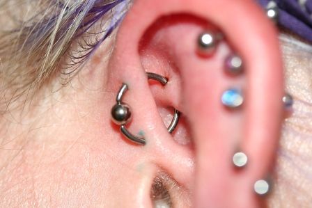 UFO Piercing With Silver Bead Ring On Left Ear