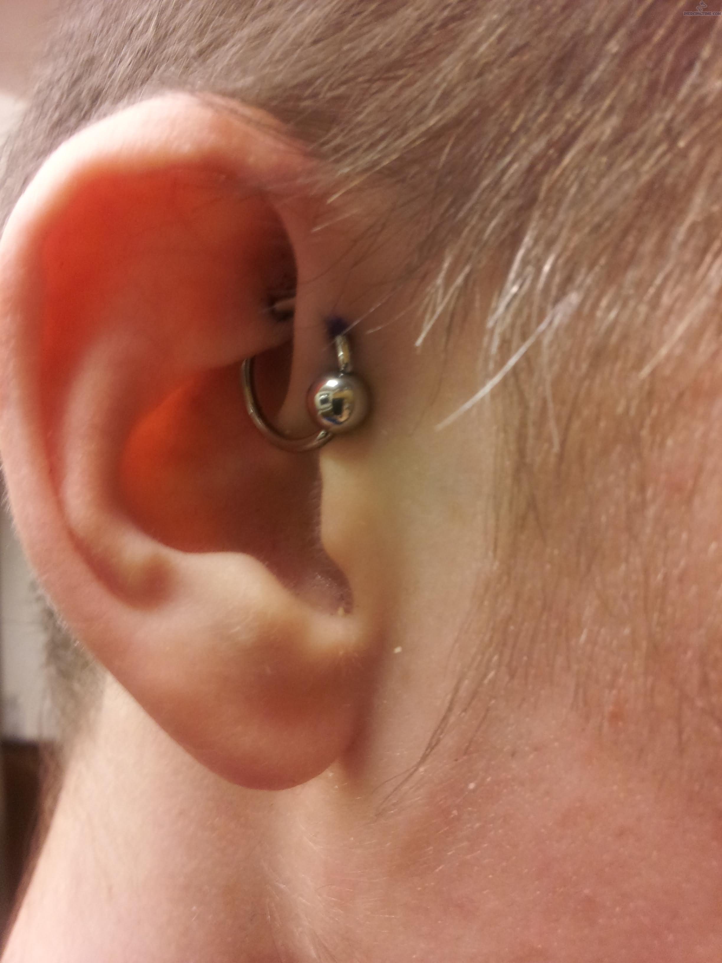 UFO Piercing With Silver Bead Ring On Right Ear