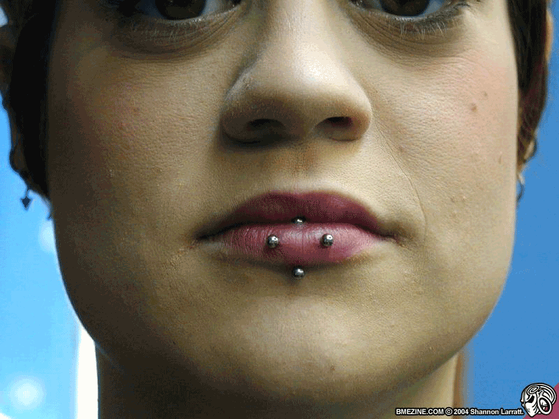 Vertical Labret And Silver Barbell Horizontal Lip Piercing