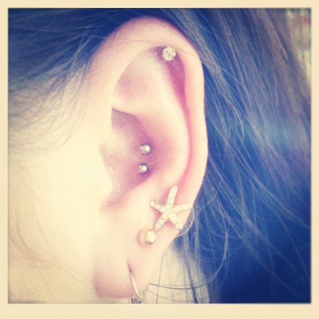 Beautiful Ear Lobe And Double Conch Piercing With Silver Studs