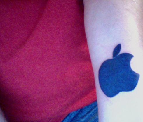 Blue Apple Logo Tattoo On Forearm