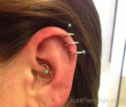 Read Complete Daith Piercing And Cartilage Spiral Piercing on Left Ear