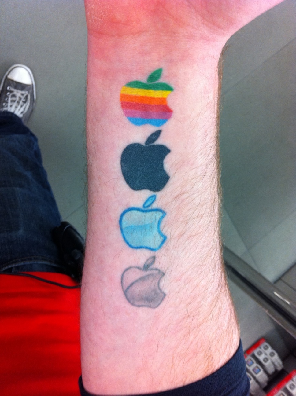 Different Iphone Apple Logos Tattoo On Forearm