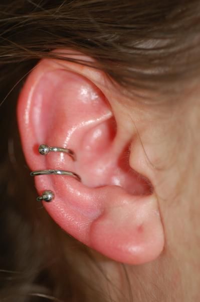 Double Inner Conch Piercing With Spiral Ring