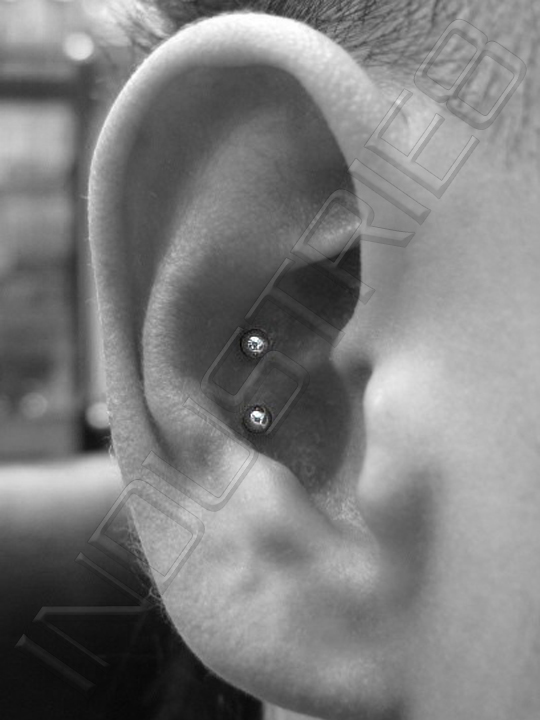 Dual Conch Piercing On Right Ear