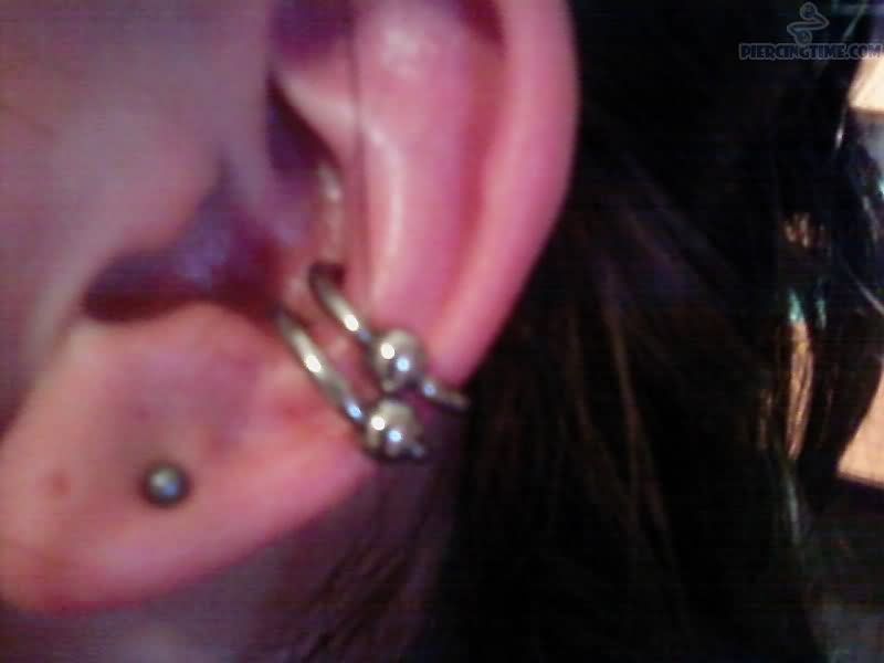 Dual Conch Piercing With Bead Rings