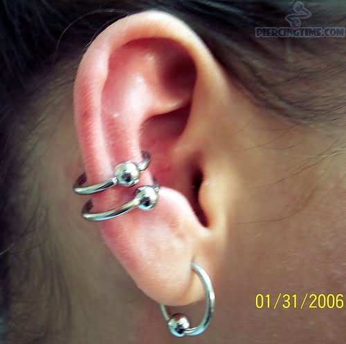 Ear Lobe And Double Conch Piercings With Bead Rings