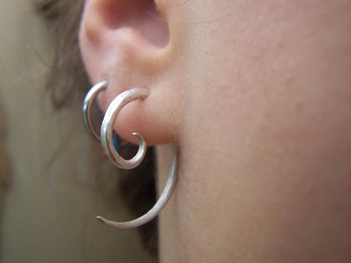 Ear Lobe Piercing With Silver Spiral Ring