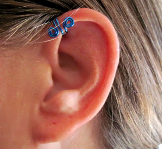 Ear Spiral Piercing With Blue Spiral Cuff