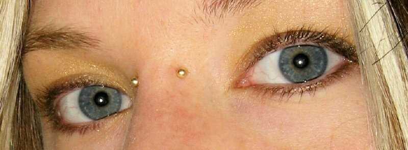 Earl Piercing With Gold Barbell