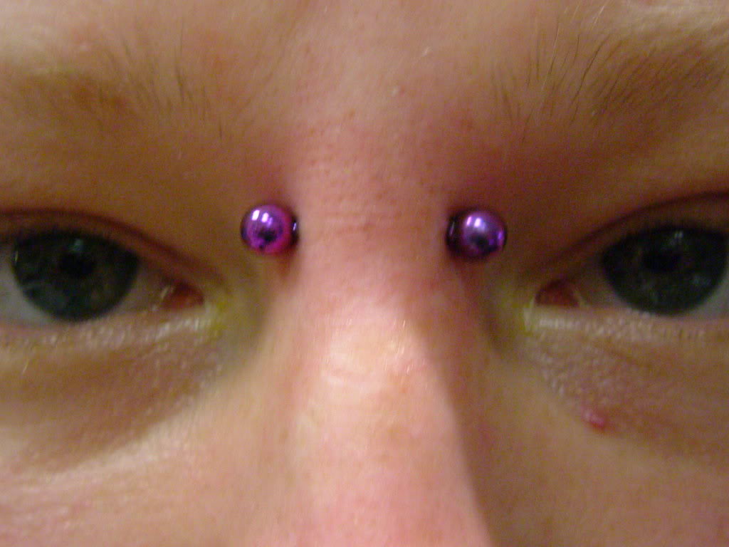 Earl Piercing With Purple Barbell