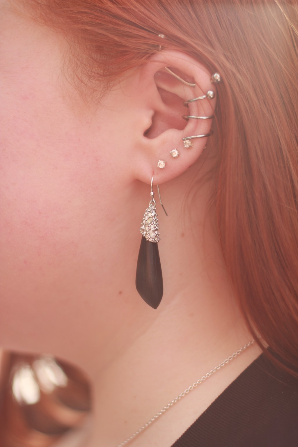 Feather Stud Lobe And Ear Spiral Piercing