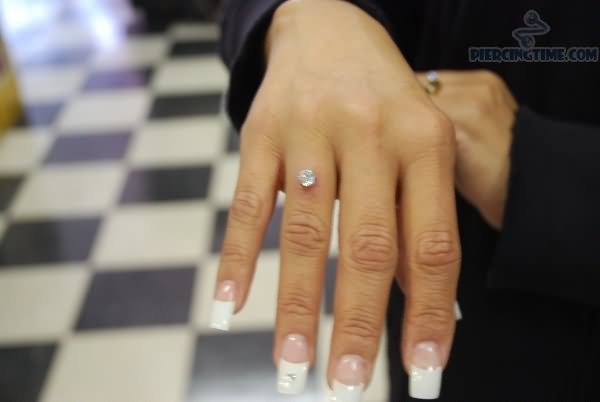 Girl Showing Her Finger Ring Piercing