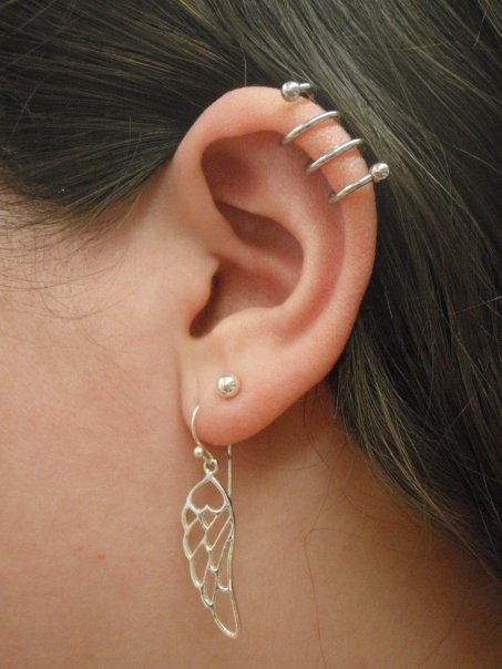 Girl With Left Ear Lobe And Ear Spiral Piercing Picture