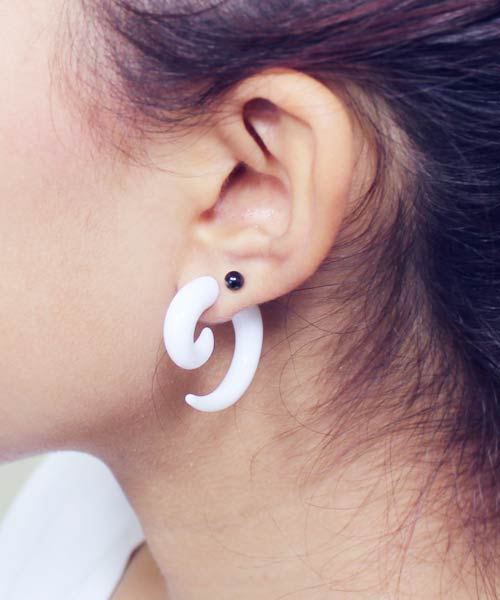 Girl With Left Ear Lobe Piercing With Spiral Ring