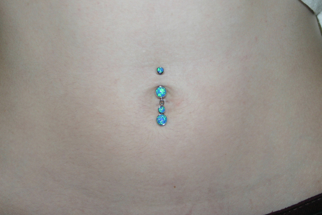 Industrial Navel Piercing With Blue Stone Jewelry