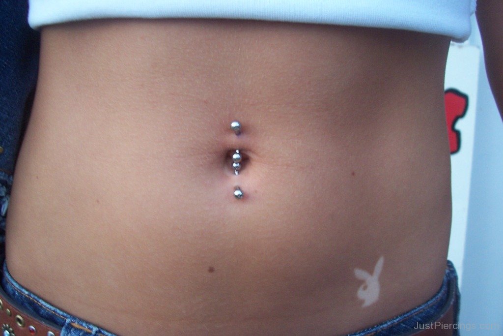 Industrial Navel Piercing With Vertical Silver Barbells