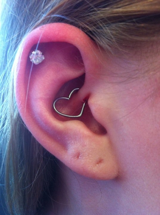 heart earring inside ear