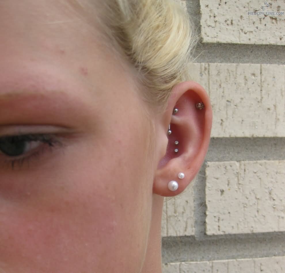 Left Ear Dual Lobe And Double Conch Piercing For Girls