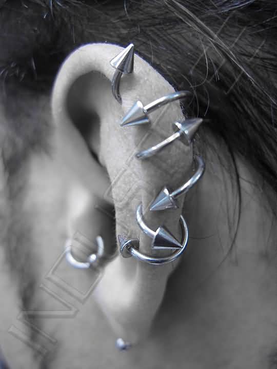 Left Ear Piercing With Silver Spike Spiral Rings