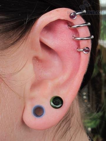 Lobe Stretching And Ear Spiral Piercing