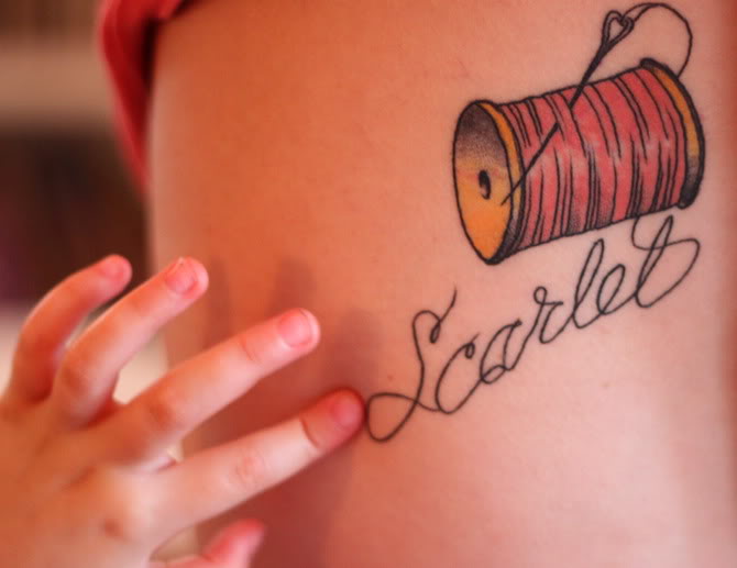 Nice Scarlet Spool Tattoo