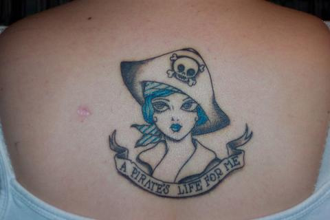 Pirate Girl Face With Lettering Banner Tattoo On Upper Back