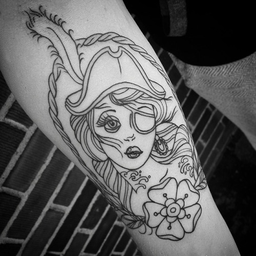 Pirate Girl In Rope Circle Tattoo On Forearm