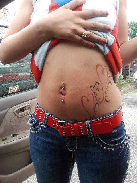 Red Heart Tattoos And Industrial Navel Piercings