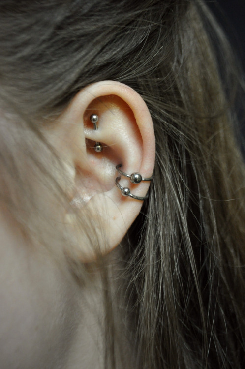 Silver Bead Rings Dual Conch Piercing On Left Ear