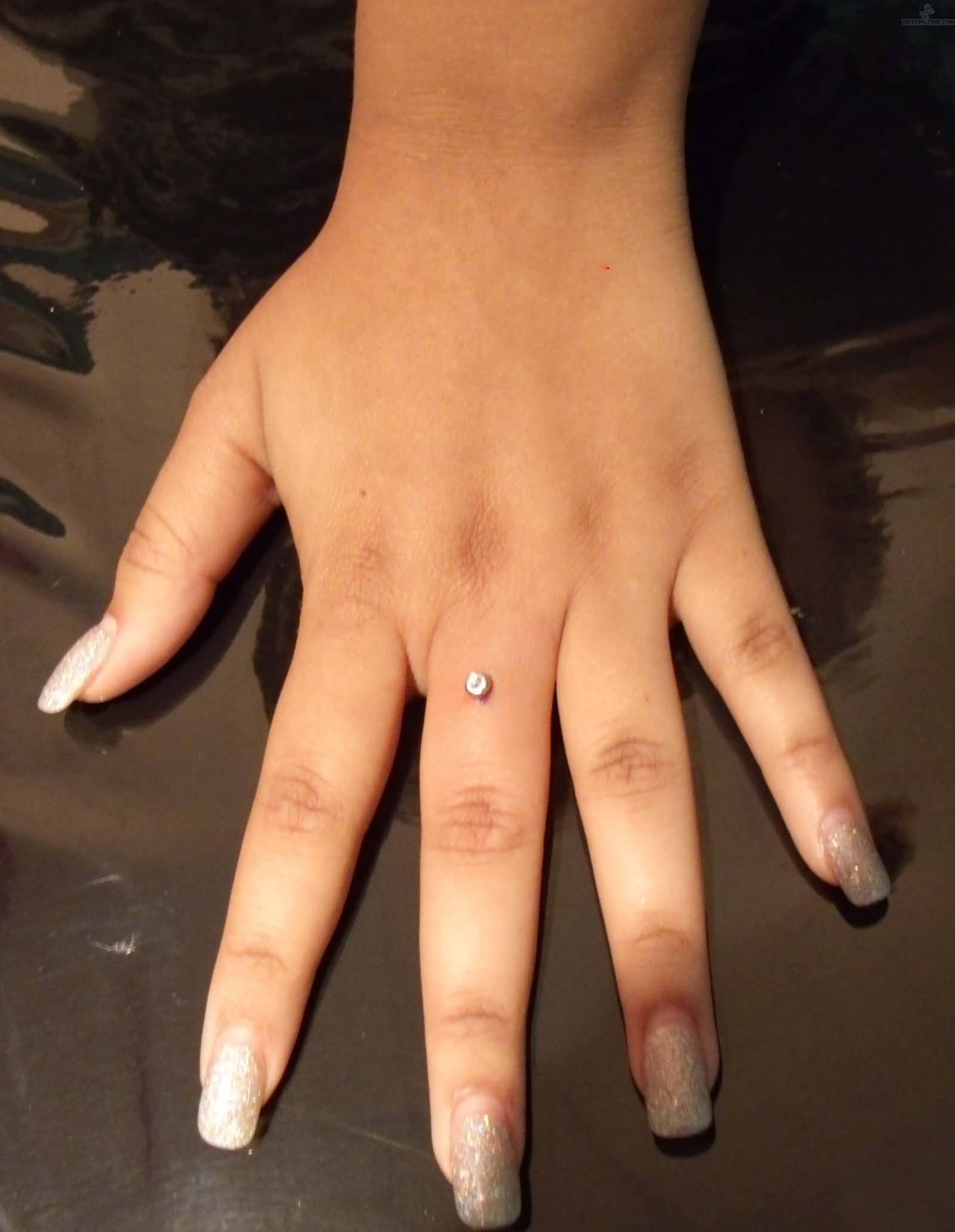 Single Dermal Anchor Finger Ring Piercing